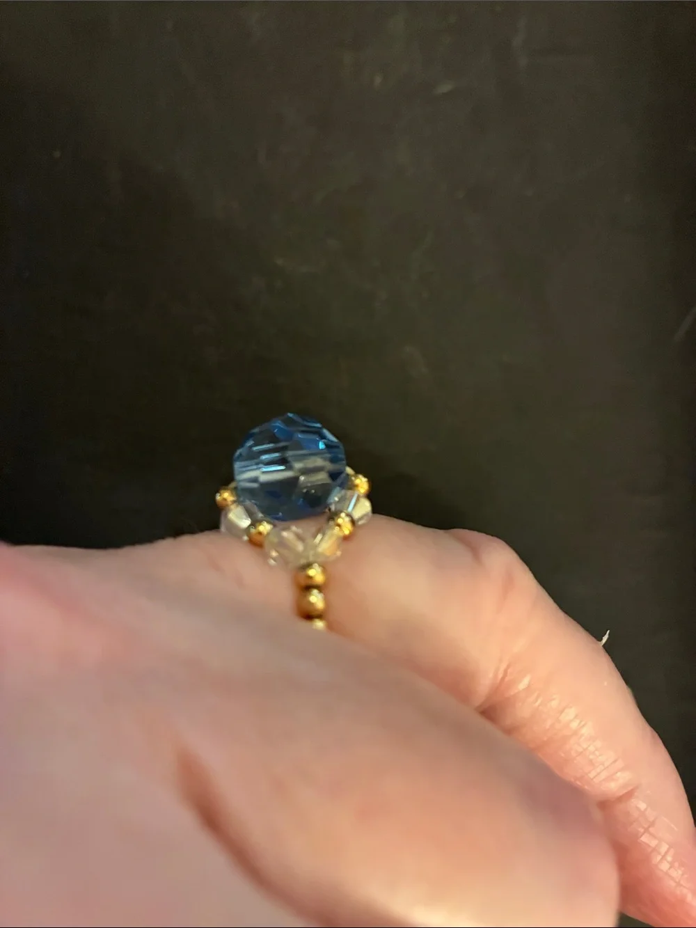 Gold-Tone Stretch Beads.Ring with Light Blue Faceted Stone and Crystal Accents.